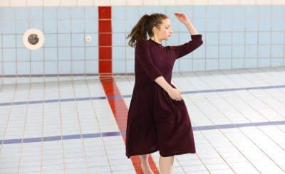 Student dancing in pool